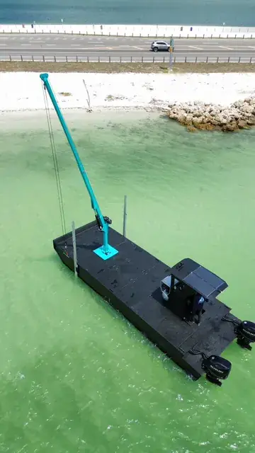 Close to Shore — Working the shallows with the crane mast lowered | HDPE work barge for sale, Fort Myers, FL