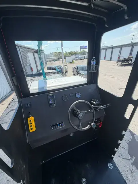 Helm — Inside the captain’s cabin — dash, controls & crane remote | HDPE work barge for sale, Fort Myers, FL