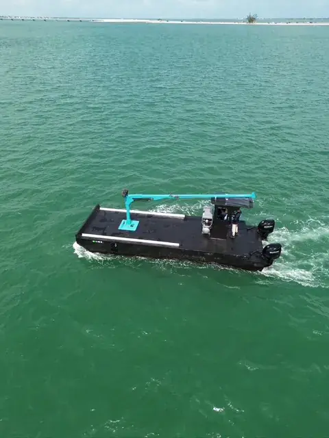 Underway — Twin Suzuki power, smooth turquoise run | HDPE work barge for sale, Fort Myers, FL